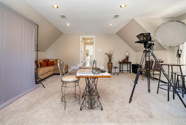 interior space with lofted ceiling, recessed lighting, visible vents, and light colored carpet