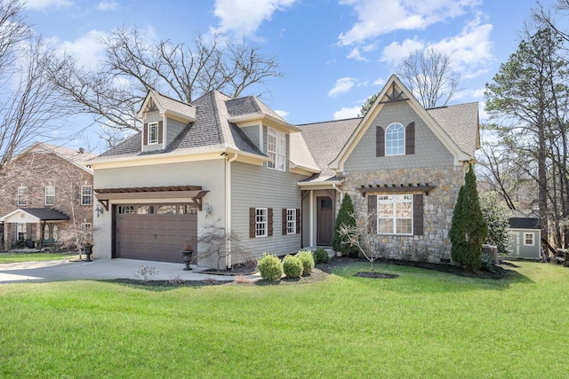 view of front of home featuring an attached garage, a shingled roof, a front lawn, and concrete driveway