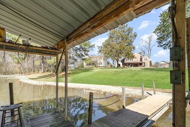 view of dock with a yard