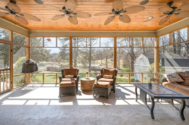 sunroom featuring wood ceiling