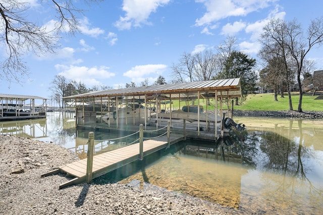 view of dock featuring a water view and boat lift