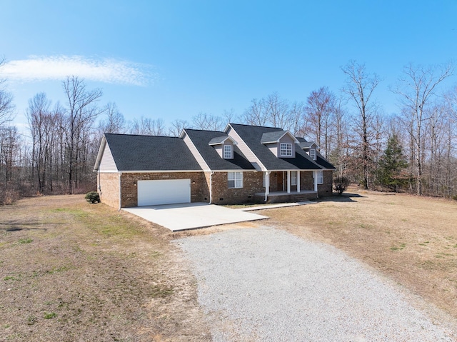 view of front of property with brick siding, a porch, an attached garage, crawl space, and driveway