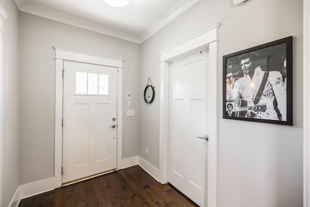 foyer entrance featuring crown molding, baseboards, and dark wood-style flooring