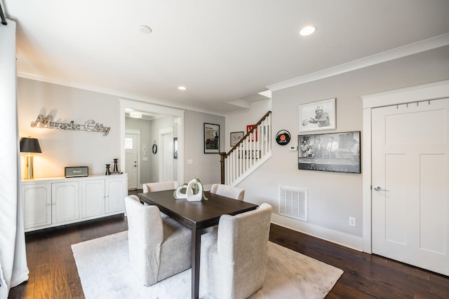 dining area featuring visible vents, stairway, ornamental molding, dark wood-style flooring, and recessed lighting