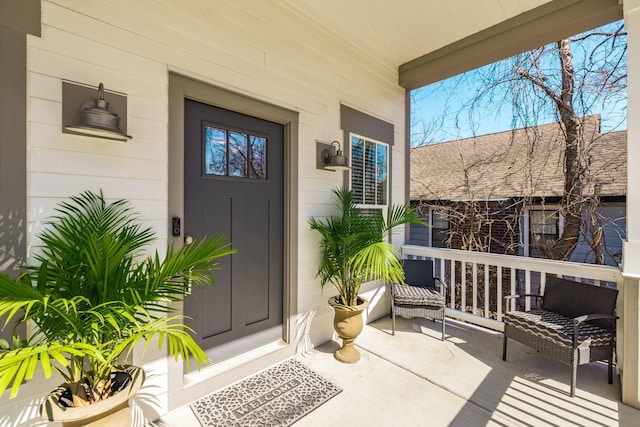 property entrance featuring a porch