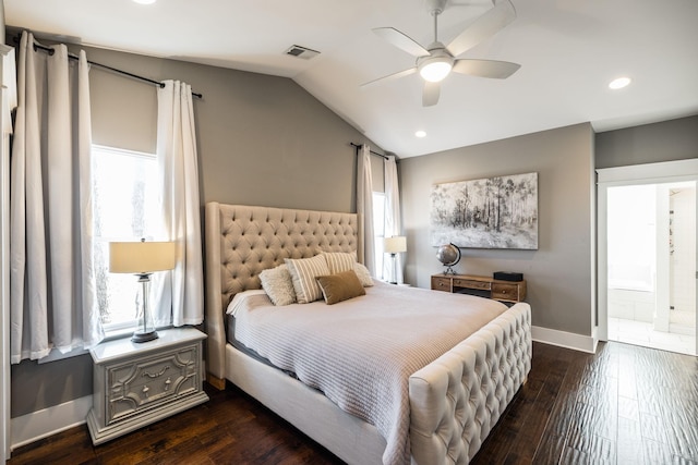 bedroom featuring lofted ceiling, multiple windows, dark wood-style flooring, and visible vents