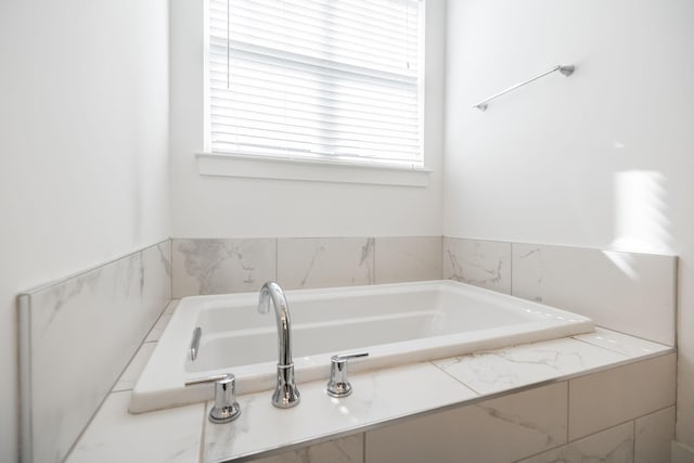 bathroom featuring a bath