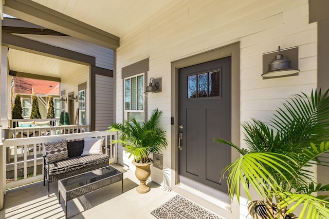 entrance to property featuring a porch