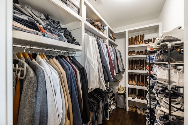 spacious closet featuring visible vents and wood finished floors