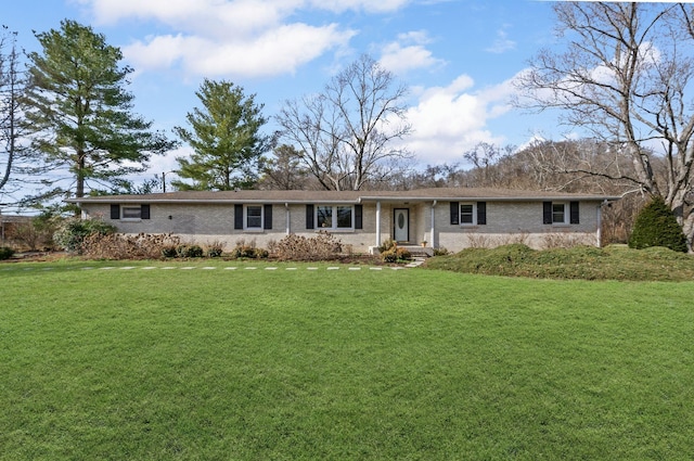 ranch-style house with a front lawn