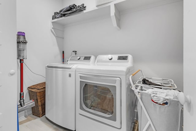 washroom with laundry area and washer and dryer