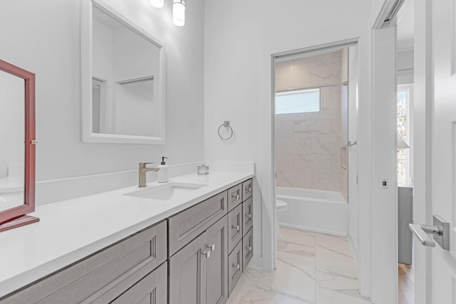 full bathroom with shower / washtub combination, marble finish floor, vanity, and toilet