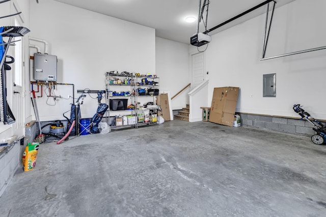 garage featuring electric panel, tankless water heater, and a garage door opener