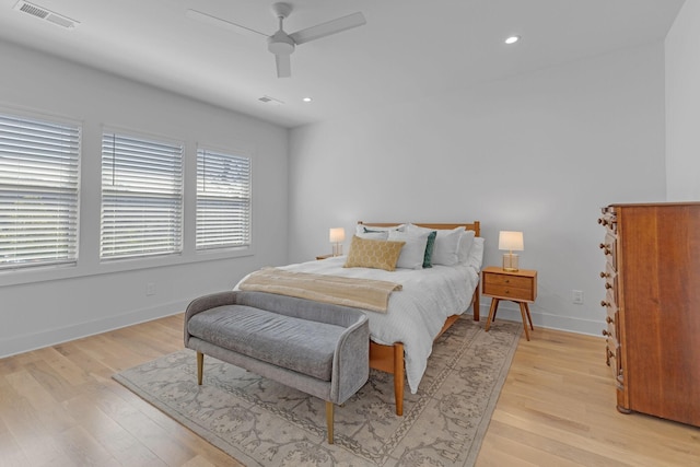 bedroom featuring baseboards, light wood finished floors, visible vents, and recessed lighting