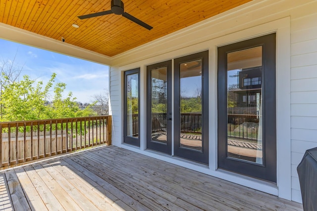 wooden deck featuring ceiling fan