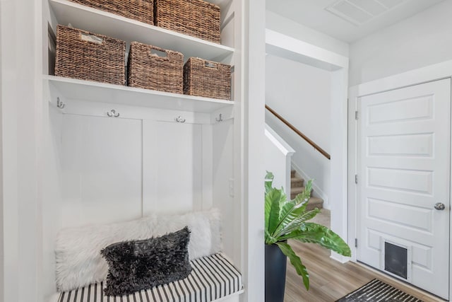 mudroom with wood finished floors and visible vents