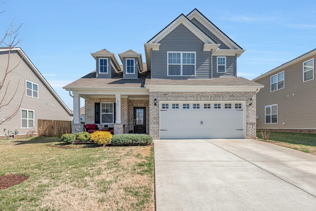 craftsman-style home with a porch, a garage, fence, driveway, and a front lawn