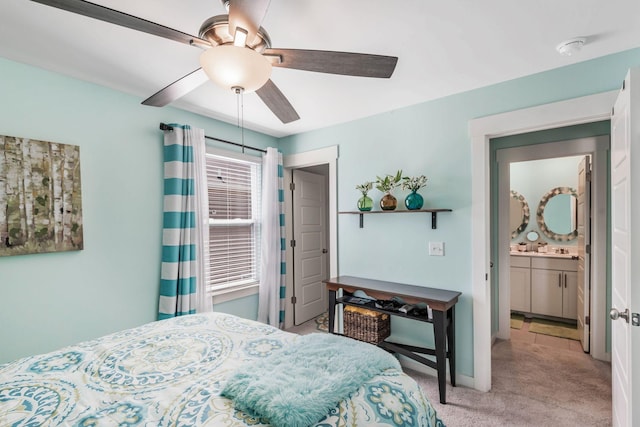 bedroom with a ceiling fan, light carpet, and baseboards