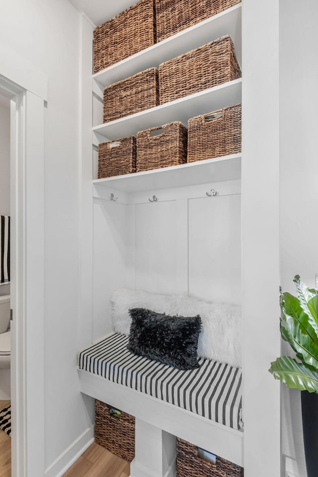 mudroom with baseboards and wood finished floors