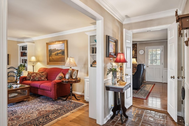 interior space featuring ornamental molding and wood finished floors