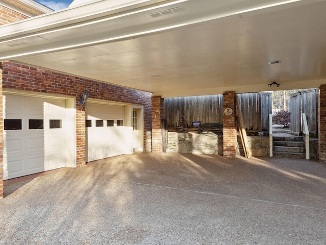 exterior space featuring driveway and visible vents