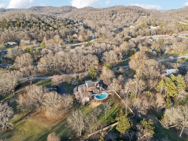 bird's eye view with a mountain view and a forest view