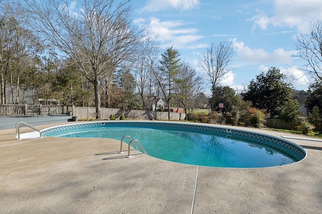 view of swimming pool with a patio, a fenced backyard, and a fenced in pool