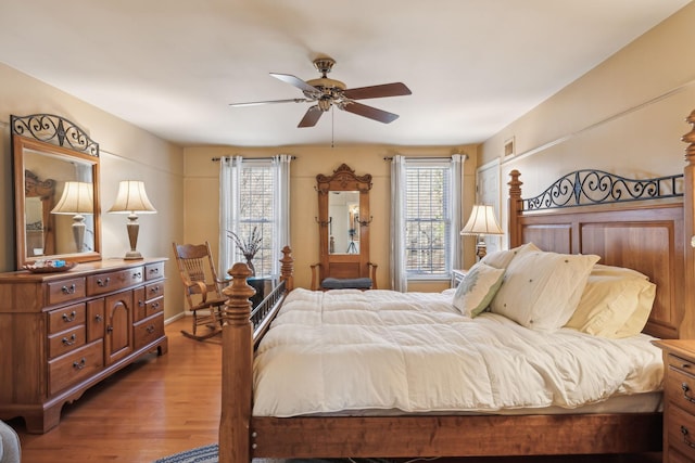 bedroom with wood finished floors and a ceiling fan