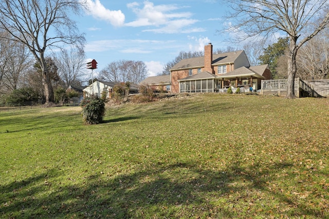 view of yard featuring a sunroom