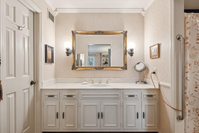 full bathroom with crown molding, vanity, visible vents, and wallpapered walls