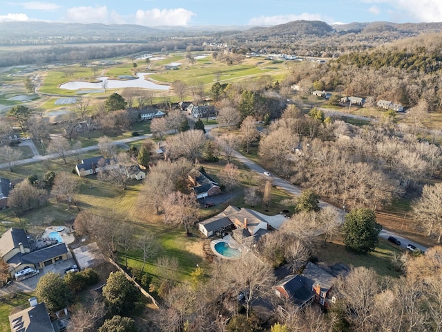 drone / aerial view with a water and mountain view