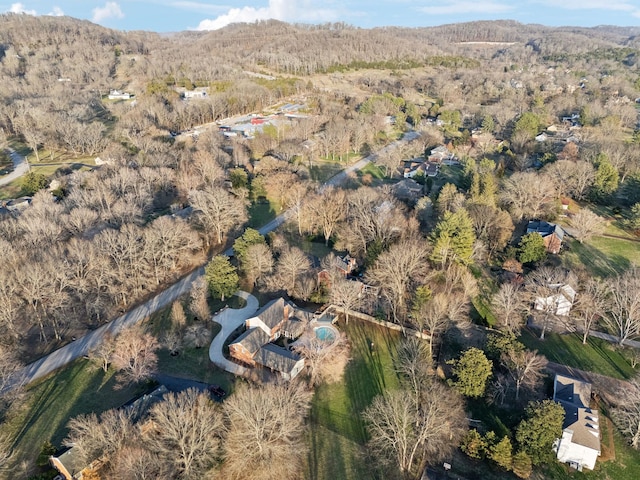 aerial view featuring a wooded view