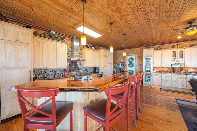 kitchen with decorative backsplash, wood ceiling, glass insert cabinets, dark wood-type flooring, and wall chimney range hood