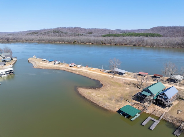 aerial view featuring a water and mountain view