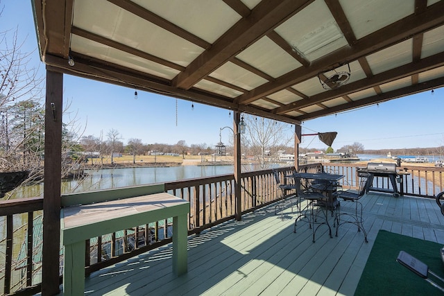 deck featuring a water view and grilling area