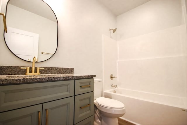 bathroom with toilet, shower / bathtub combination, wood finished floors, and vanity