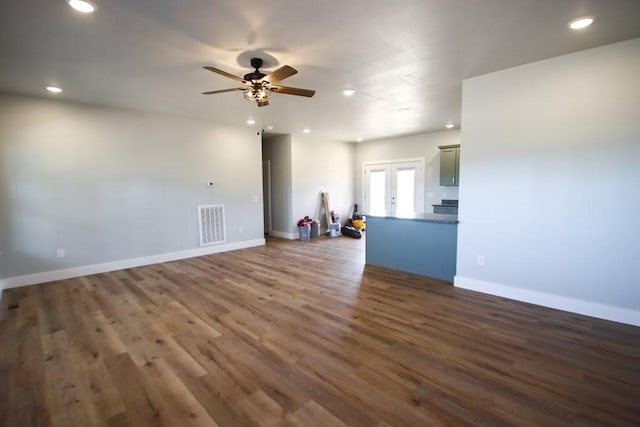 unfurnished room with baseboards, visible vents, wood finished floors, and recessed lighting