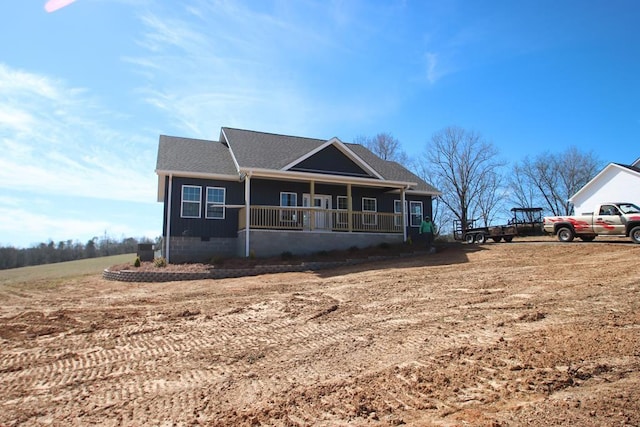 view of front of home featuring covered porch and crawl space