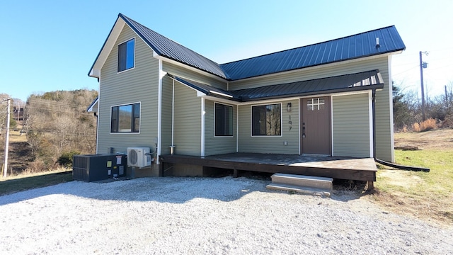 exterior space with metal roof, ac unit, and central air condition unit