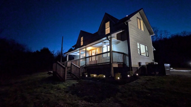 property exterior at night featuring stairway