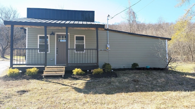 view of front of property with covered porch and metal roof