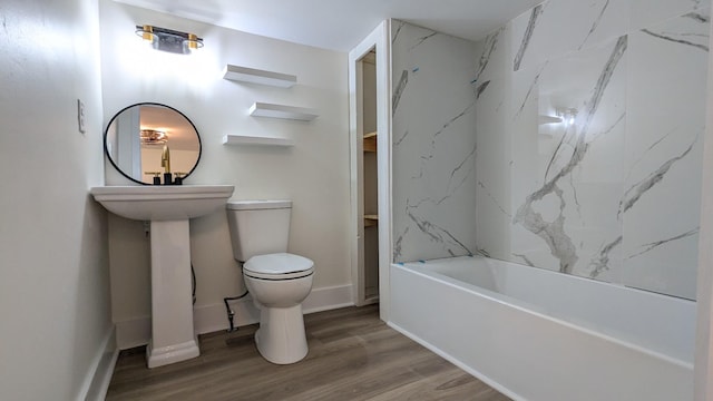 bathroom featuring toilet and wood finished floors