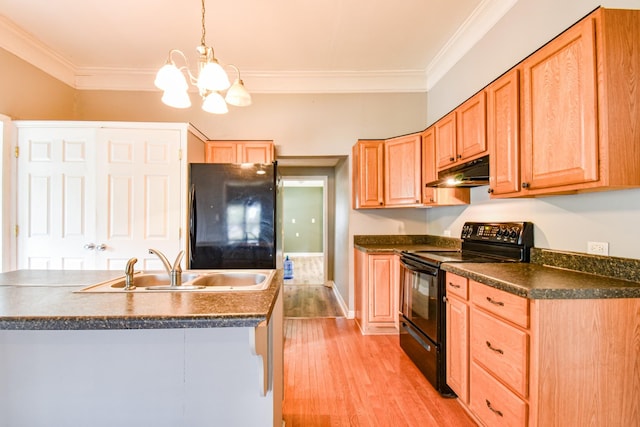 kitchen featuring dark countertops, black appliances, under cabinet range hood, and crown molding