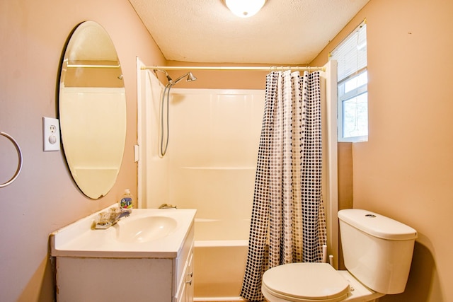 bathroom with a textured ceiling, shower / tub combo, vanity, and toilet