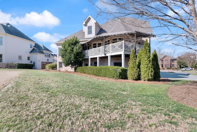 exterior space featuring brick siding and a lawn