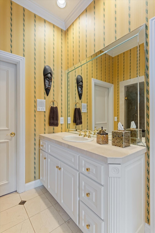 bathroom featuring ornamental molding, vanity, and wallpapered walls