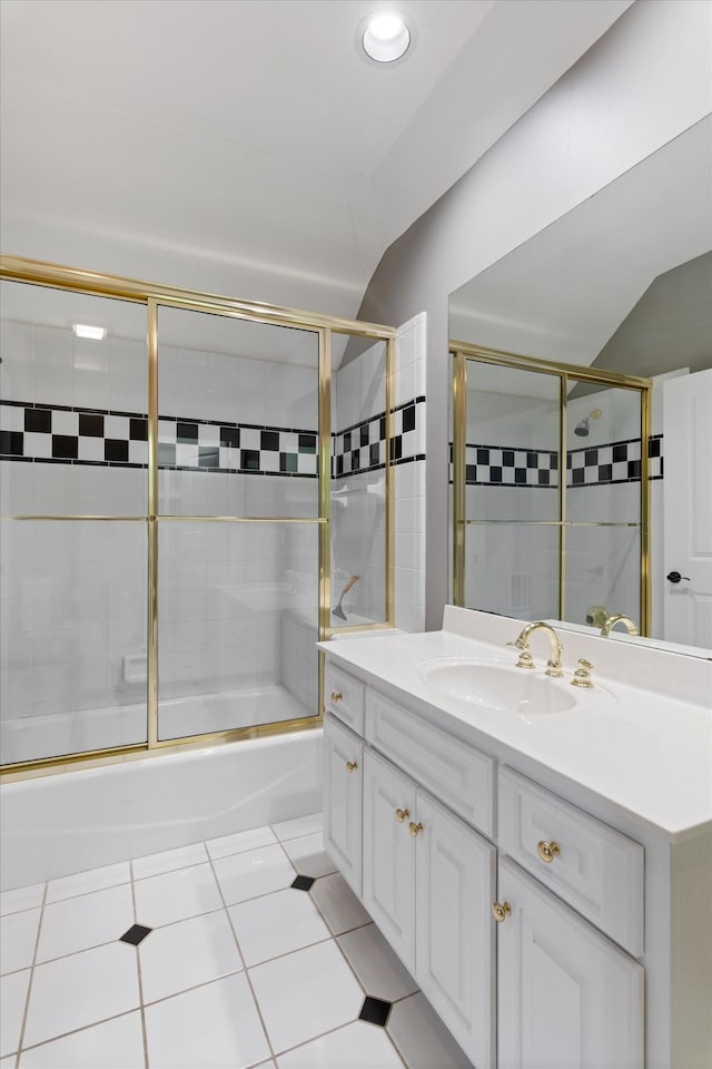 full bath with shower / bath combination with glass door, vanity, and tile patterned floors