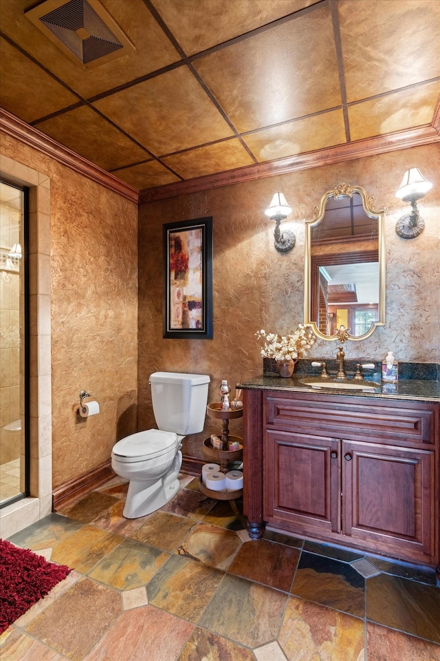 full bathroom with stone tile floors, visible vents, toilet, vanity, and tiled shower