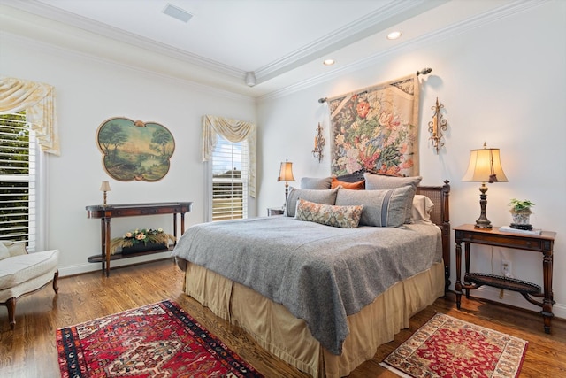 bedroom featuring baseboards, recessed lighting, wood finished floors, and crown molding