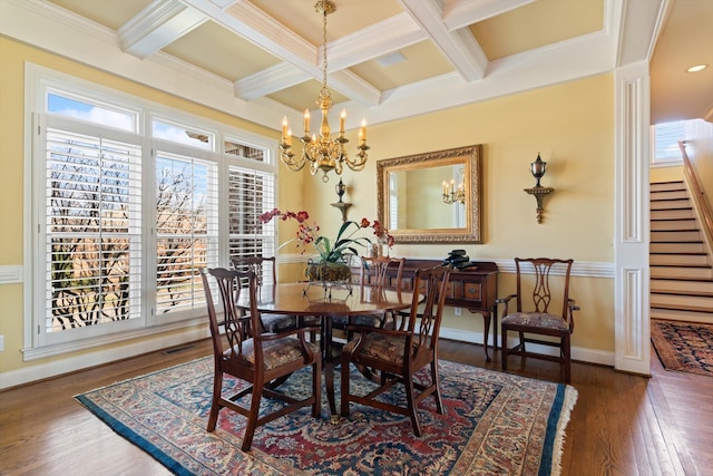 dining space featuring a chandelier, beam ceiling, stairway, and wood finished floors